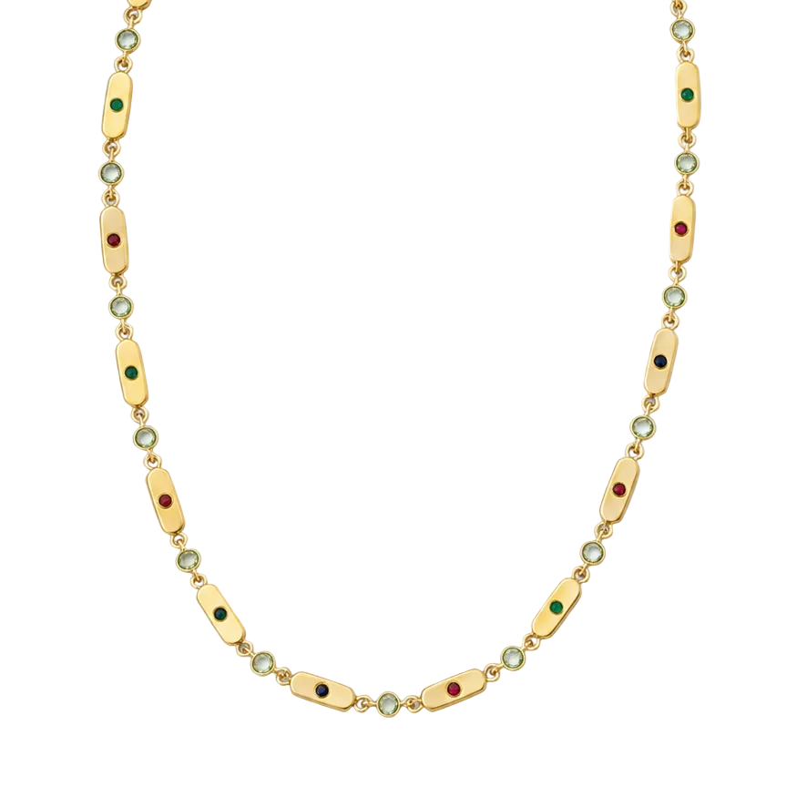 A gold chain necklace featuring elongated oval links with small green and red enamel accents, interspersed with tiny round clear stones, shown against a plain white background.