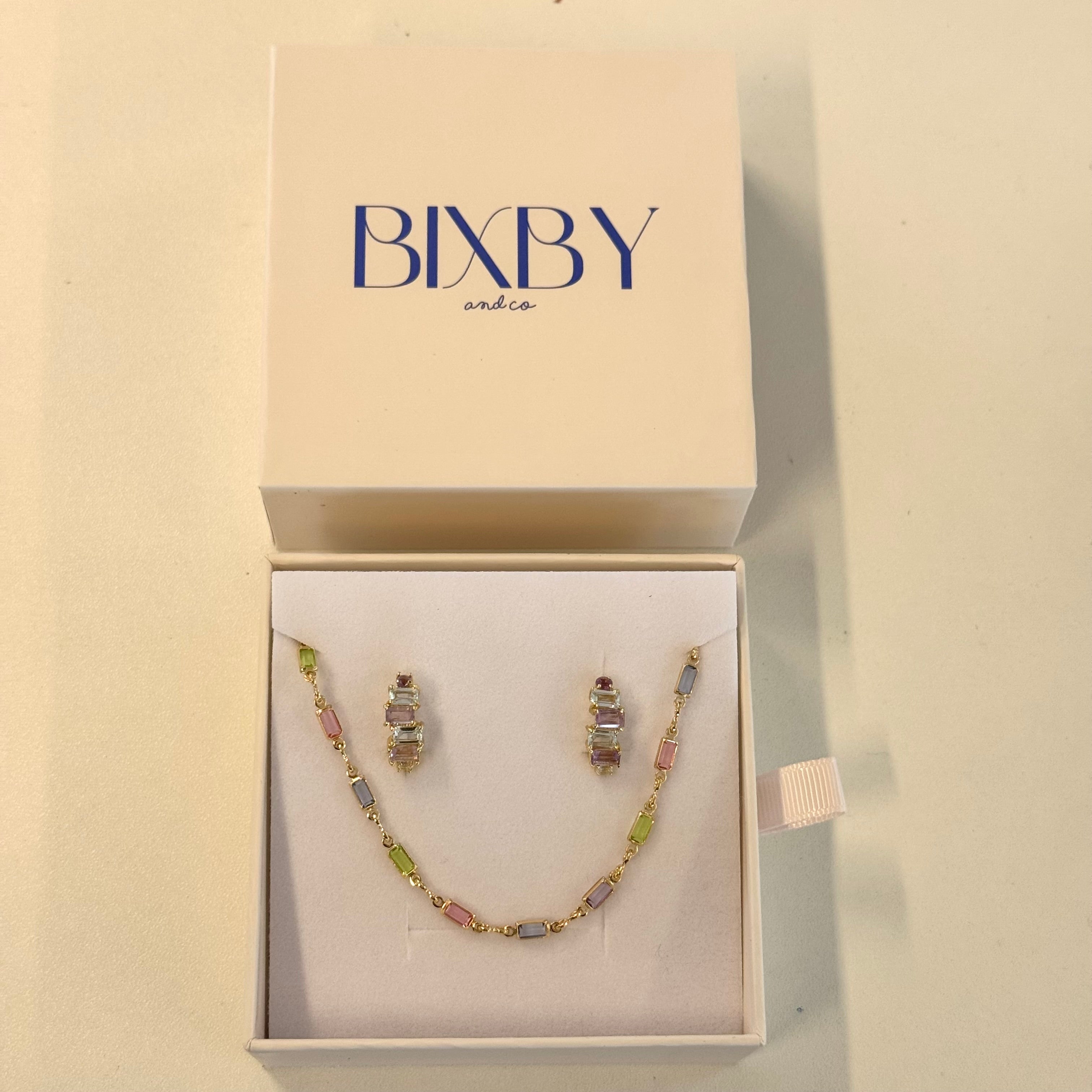 Jewelry set in a Bixby box on a beige background