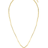 Gold necklace with a heart-shaped pendant on a white background