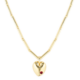 Gold heart-shaped necklace with a red gemstone on a white background