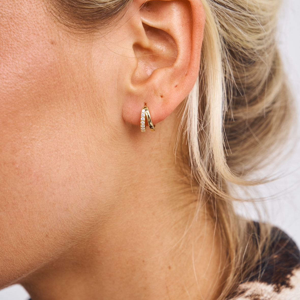 Small crystal double huggies in gold 