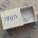 BXBY jewelry box with a silver ring inside on a branded background