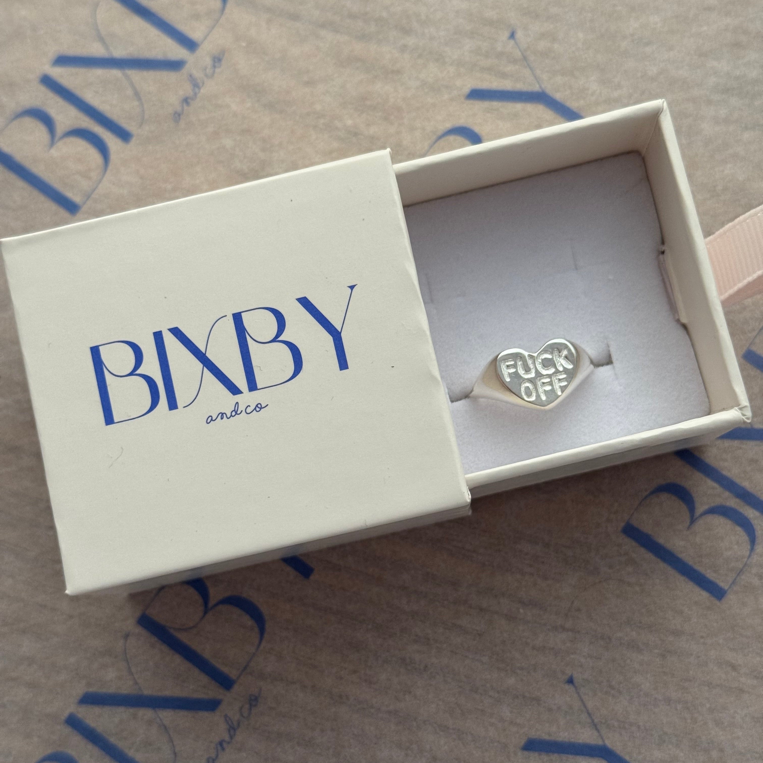 BXBY jewelry box with a silver ring inside on a branded background