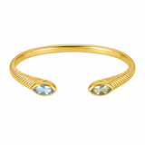 A gold-toned open cuff bracelet with a textured rope-like finish and two marquise-cut light blue gemstones at the ends, shown on a plain white background.