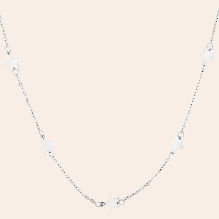 Silver necklace with star-shaped pendants on a white background