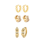 Set of gold hoop earrings with small diamonds on a white background