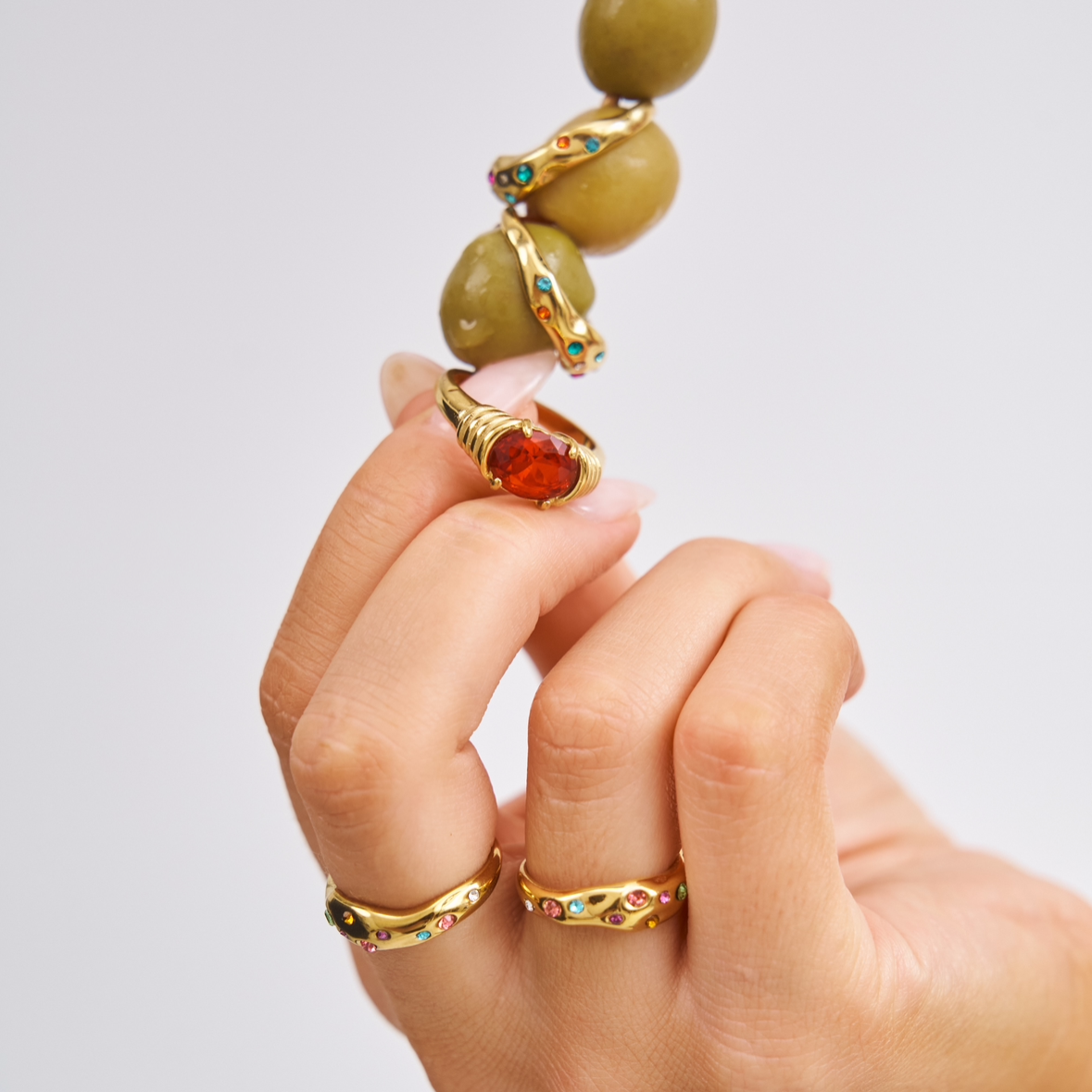 Bixby Rings styled up close on a cocktail stick with olives 