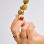 Bixby Rings styled up close on a cocktail stick with olives 