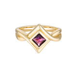 Gold ring with a pink gemstone on a white background