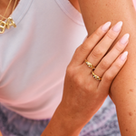 Wavy shaped 18k gold on stainless steel with clear crystal gems 