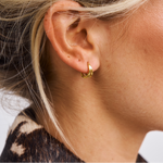 Close up of Agnes Huggies on model 