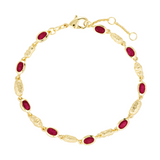 Gold bracelet with red gemstones on a white background