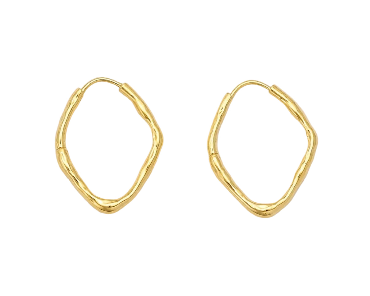 A pair of gold abstract wavy hoop earrings on a light gray background.