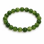Green beaded bracelet on a white background