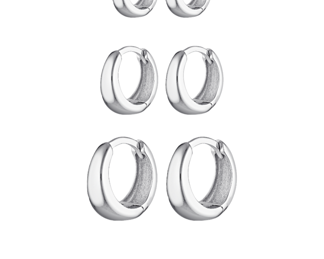 Set of six silver hoop earrings on a white background