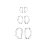 Set of silver hoop earrings on a white background