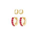 Gold hoop earrings with pink accents on a white background
