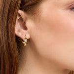 Close up of Alma Hoops in gold 