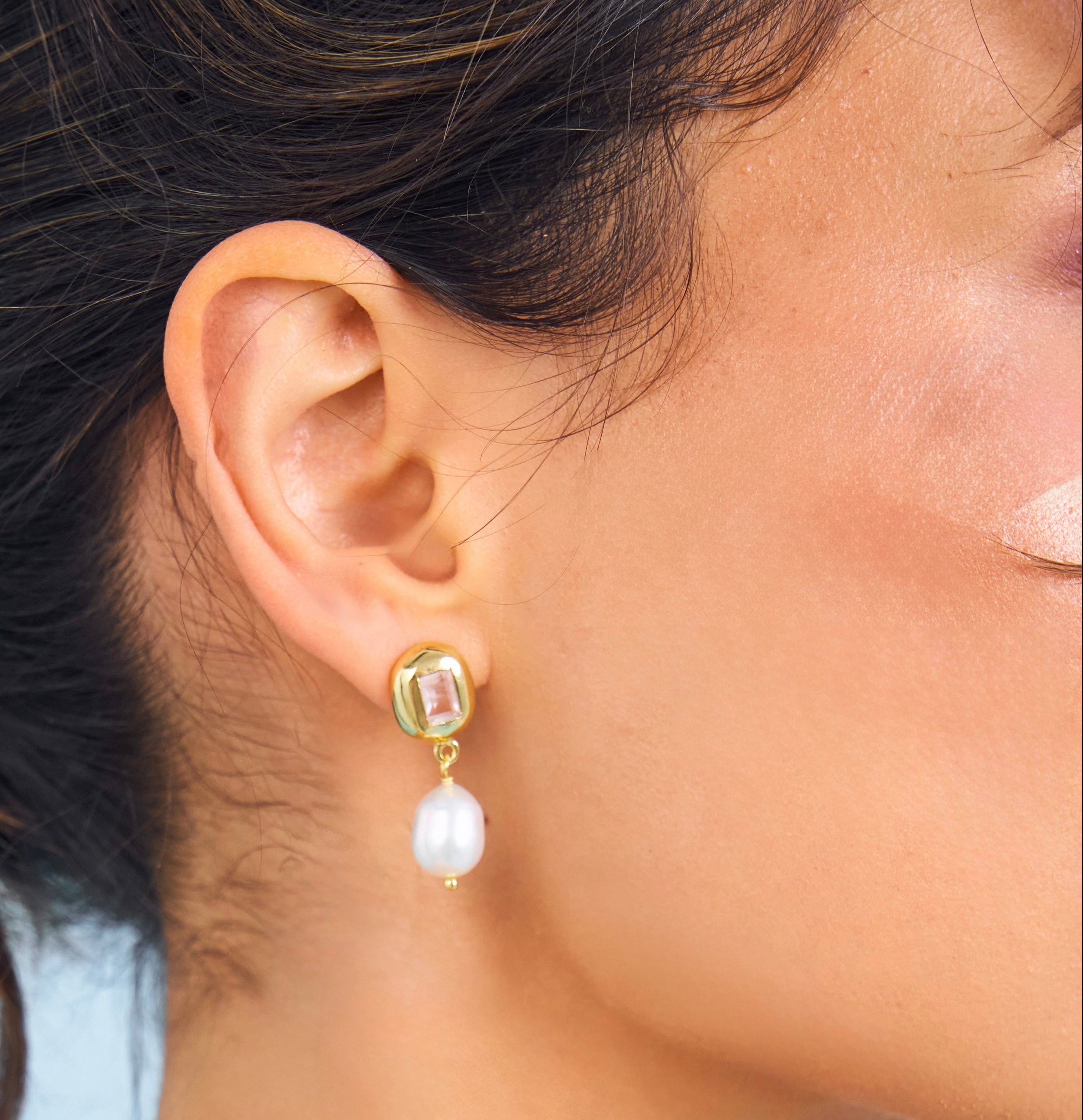 Close up of Pearl and pink gemstone earring from Bixby and Co