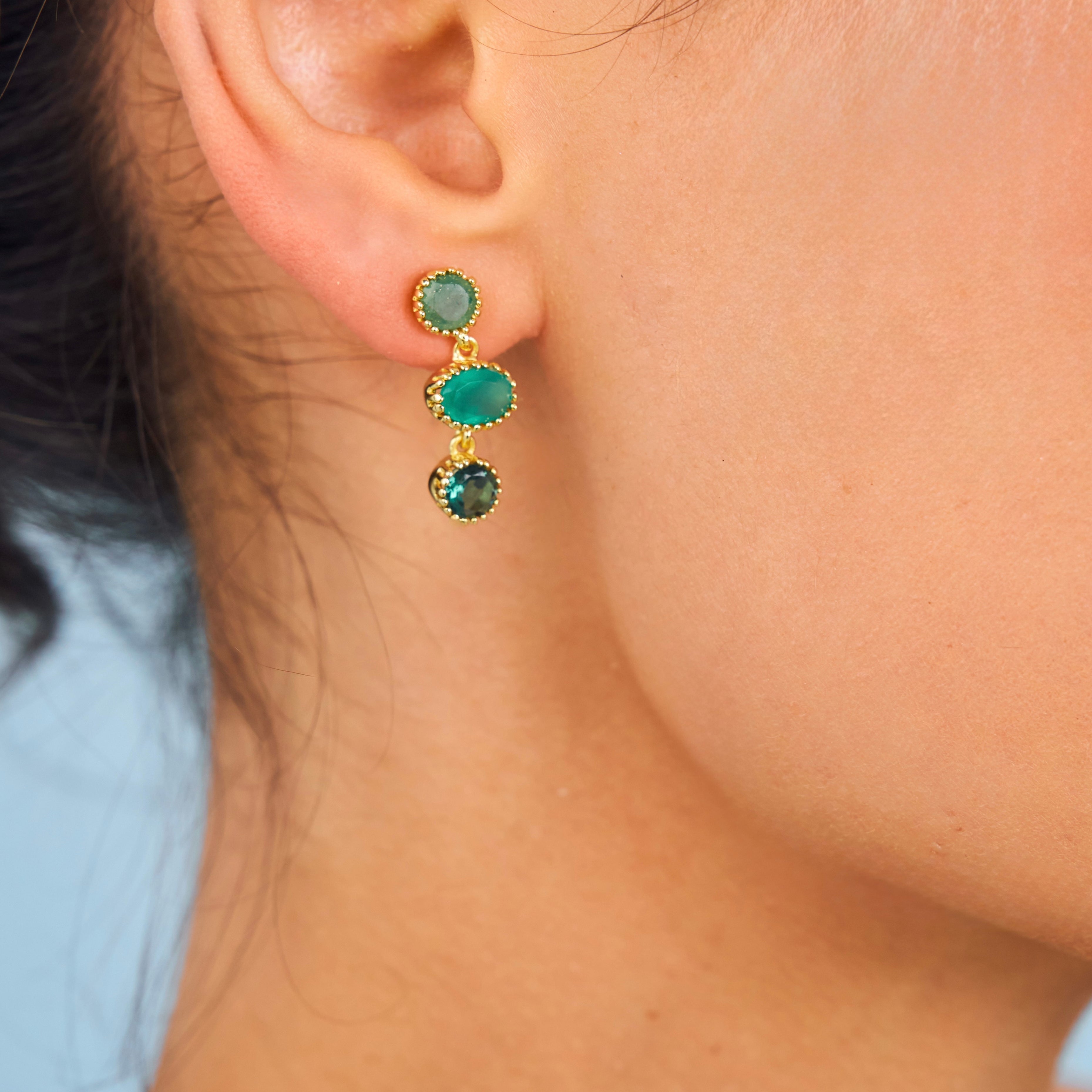 Close up of Emeraude earrings in green onyx and jade 