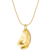 Gold pendant necklace on a white background
