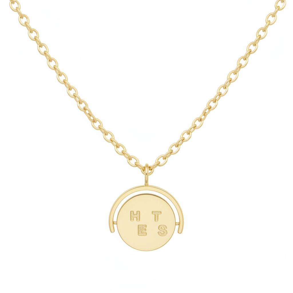 Gold necklace with a round pendant on a white background