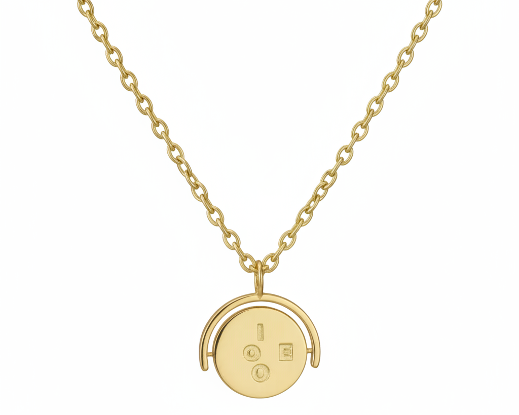 Gold necklace with a round pendant on a white background