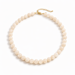 Pearl necklace with gold clasp on a white background