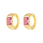 Gold hoop earrings with pink gemstones on a white background
