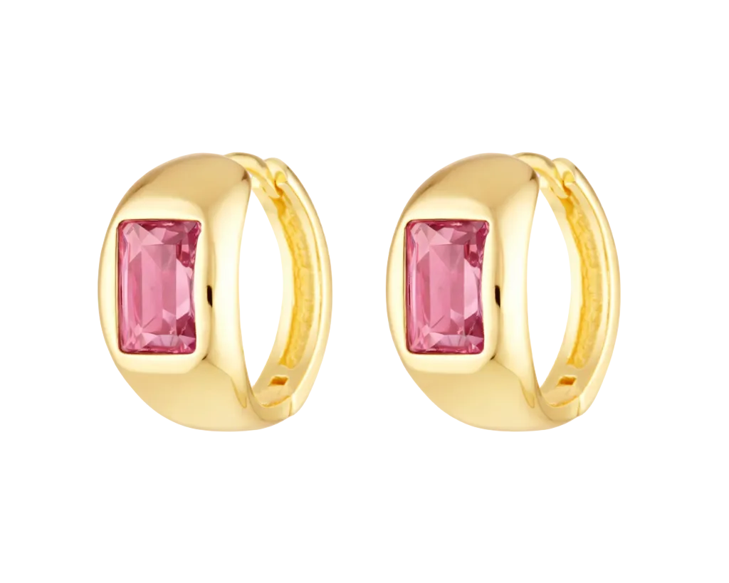 Gold hoop earrings with pink gemstones on a white background