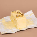 Champagne collection rings displayed in butter stick