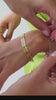 Video of gold bracelets on model 