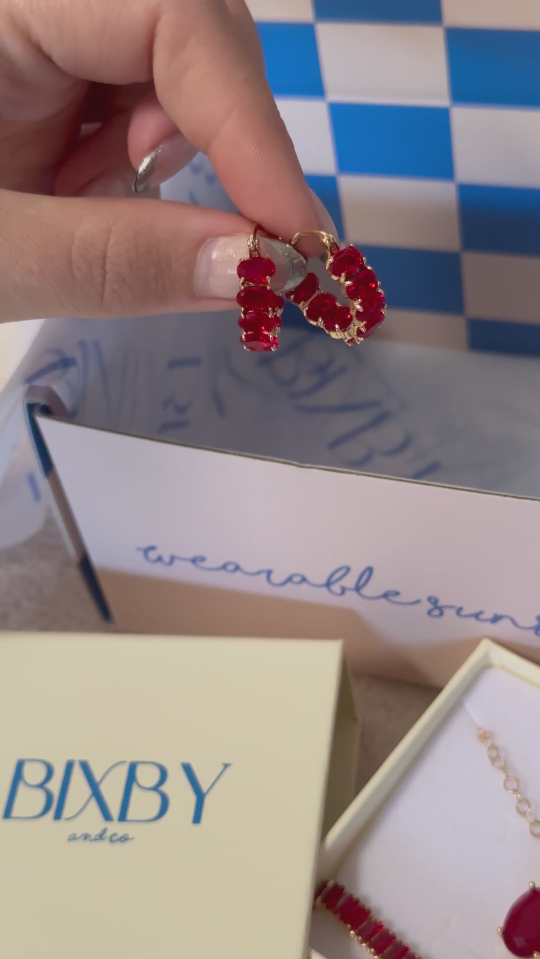 video of Bixby packaging showing off the red Isolde Hoops