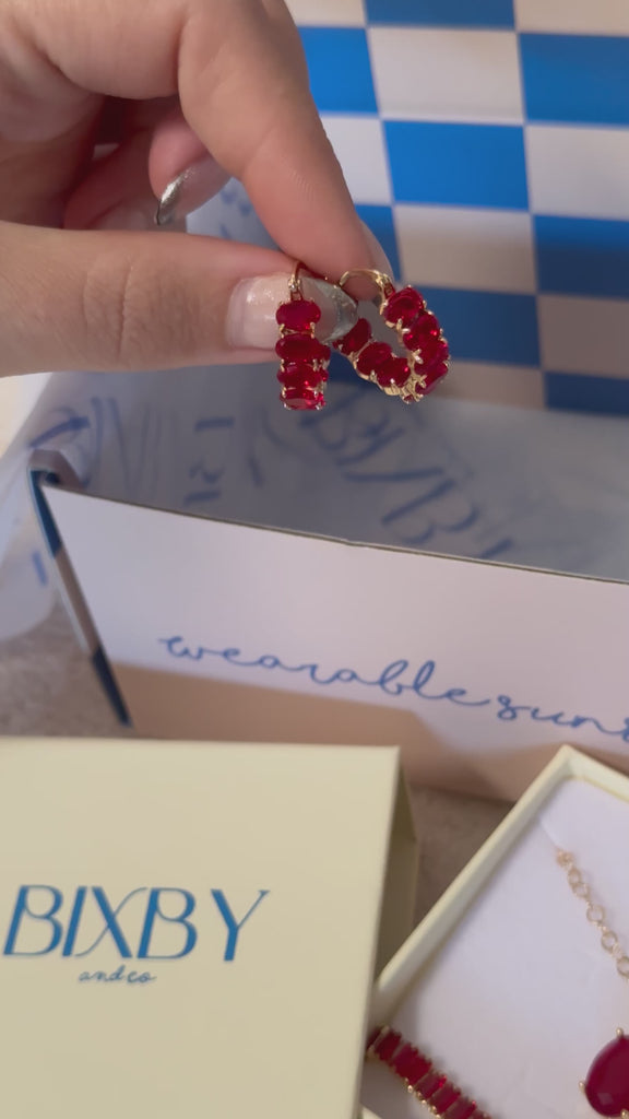 video of Bixby packaging showing off the red Isolde Hoops