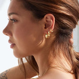 Model showing Bixby and Co earrings