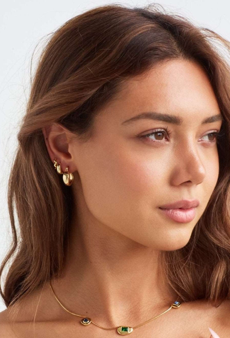 Model in Lime Drop gold hoop earrings