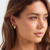 Model in Lime Drop gold hoop earrings